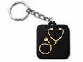 Black acrylic keychain with gold mirror stethoscope design and silver steel chain, made in India