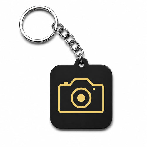 Black acrylic camera keychain with gold camera icon and metal chain