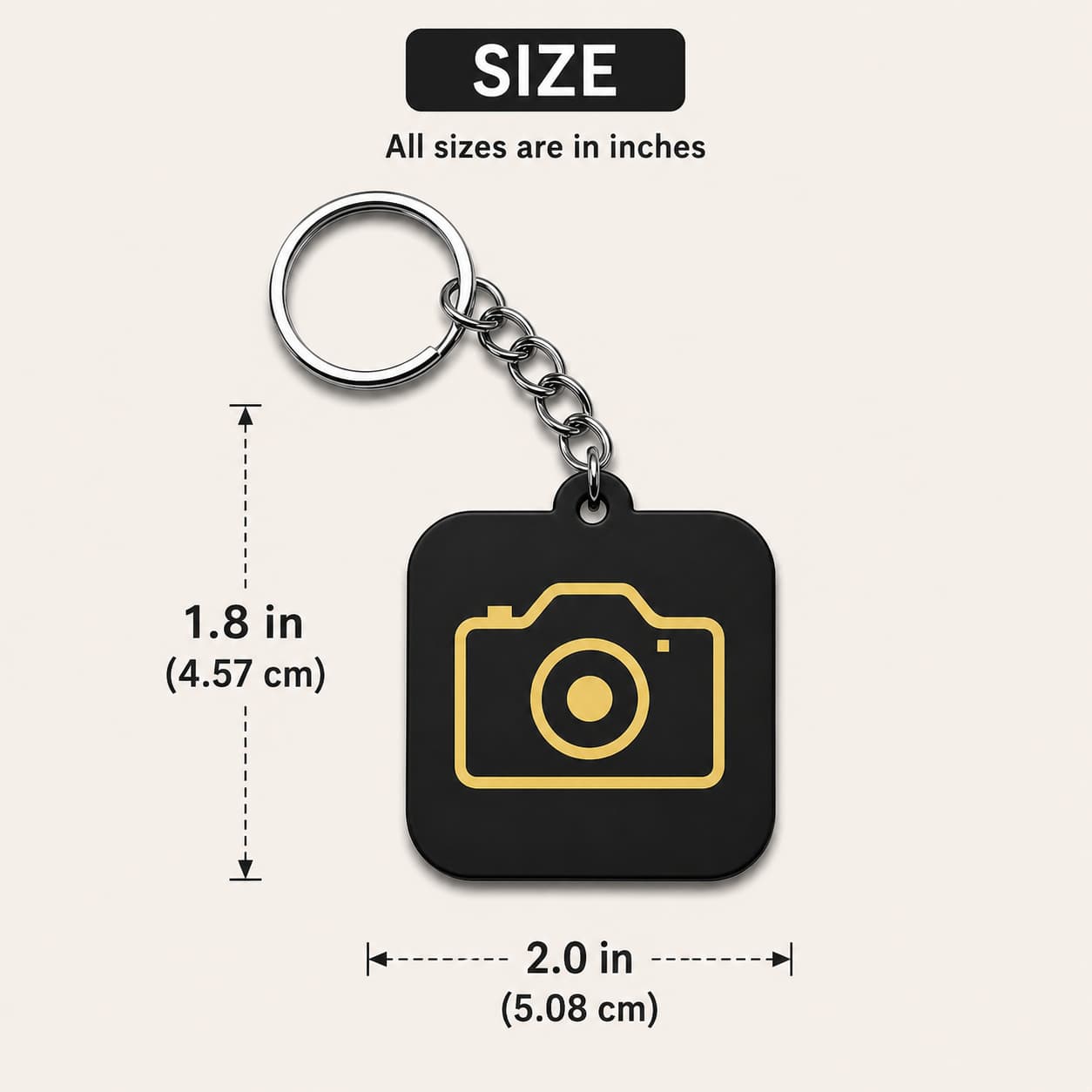 Black acrylic camera keychain with gold camera icon measuring 1.8 inch height and 2 inch width