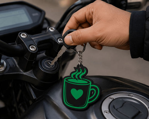 Hand inserting bike key with black green acrylic coffee mug keychain attached, gift for coffee lovers