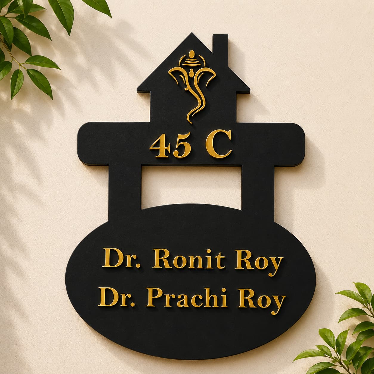 Custom doctor name plate with black acrylic base and gold mirror acrylic letters mounted on wall