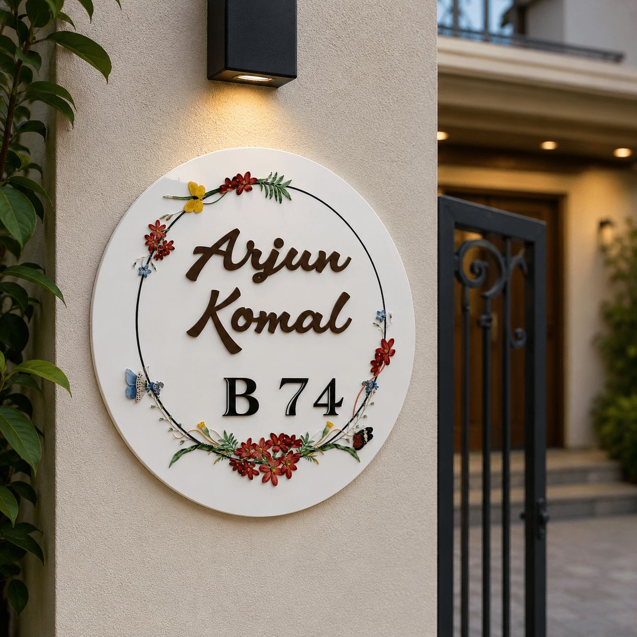 Round acrylic name plate with wildflower UV print installed on house exterior wall, made in India