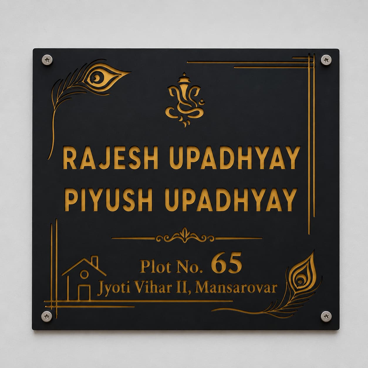 Debossed black acrylic name plate with gold mirror backing and Ganesha design