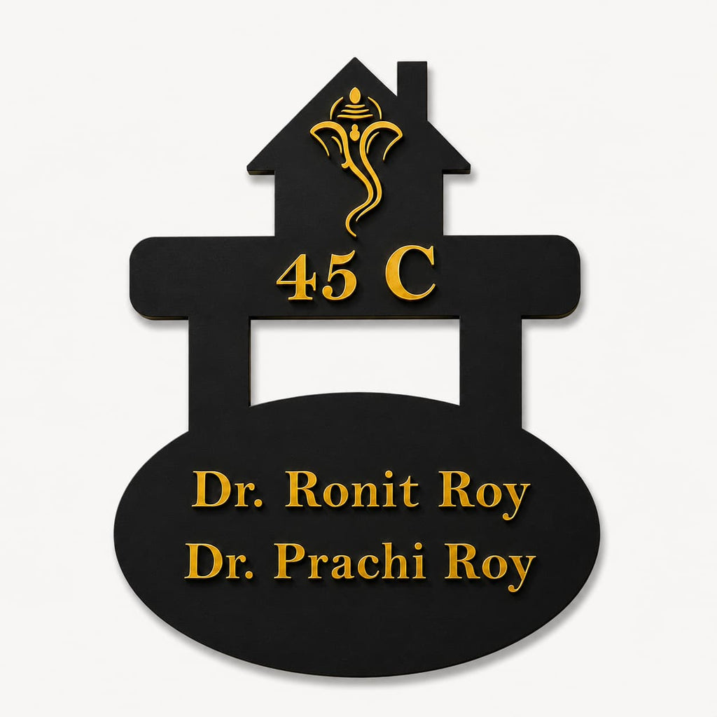 Custom doctor house name plate with black acrylic base and gold mirror acrylic raised lettering on clean background