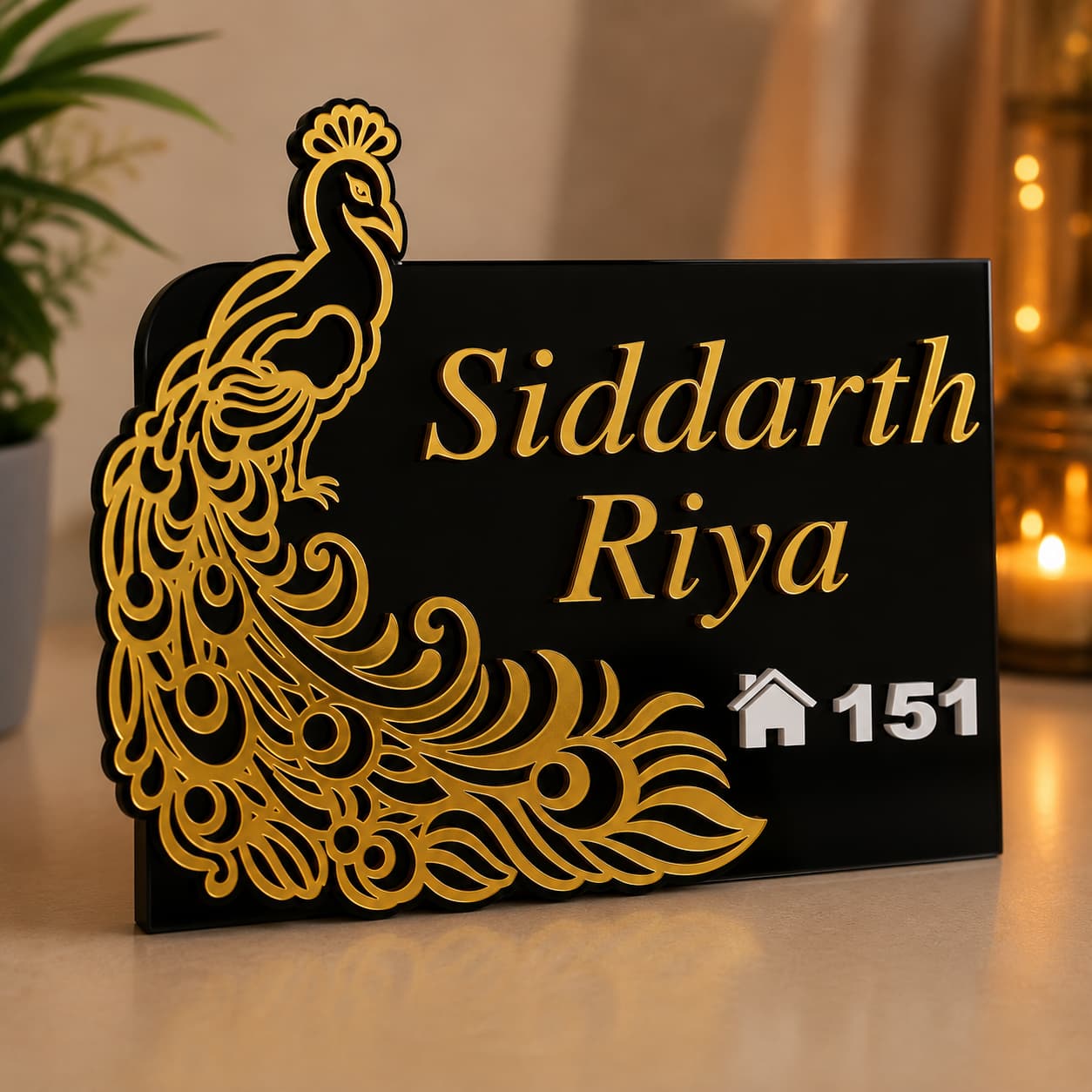 Black and gold peacock acrylic house name plate on table