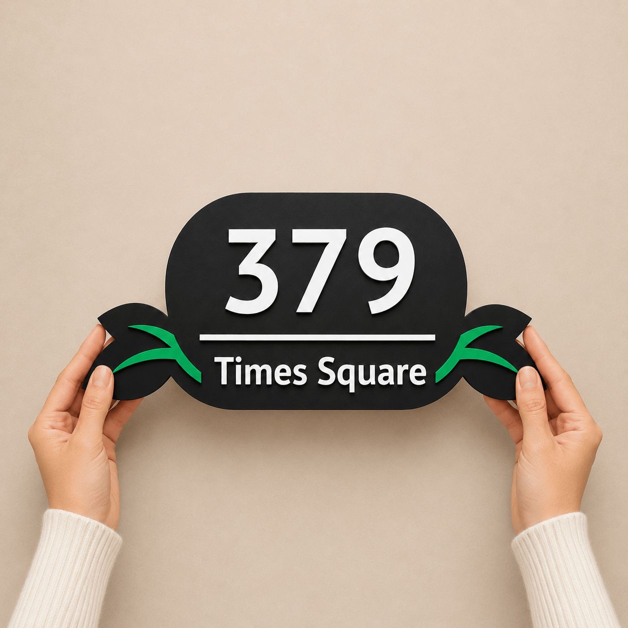 Hands holding a black acrylic number plate with embossed 3D letters and green leaf design, India