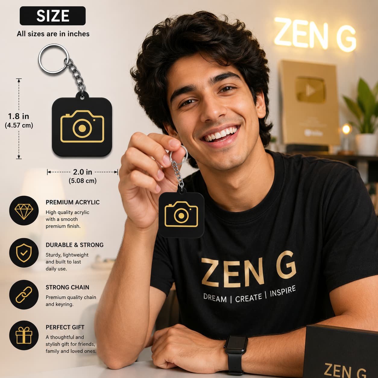 Smiling content creator holding black acrylic camera keychain with gold camera design